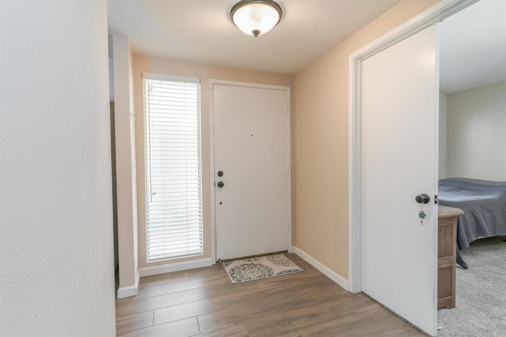 23691 Country Villa Road Ramona, CA 92065 - Photo 10 of 22 an empty room with wooden floor and windows