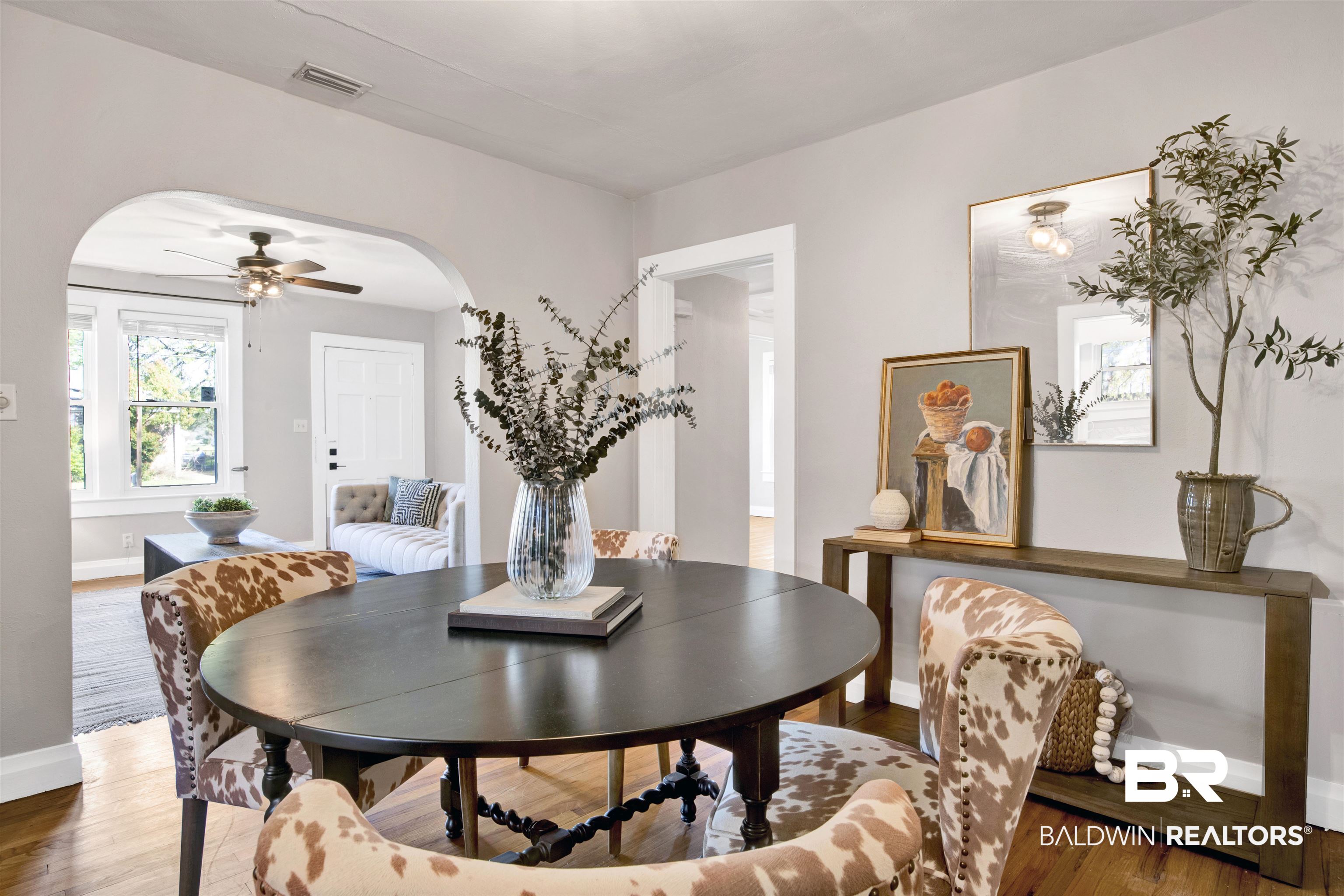 160 Emogene Place Mobile, AL 36606 - Photo 6 of 32 Dining area featuring a ceiling fan, wood finished floors, and arched walkways