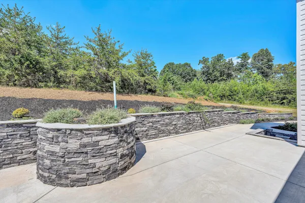 a bathroom with a double vanity sink toilet and shower