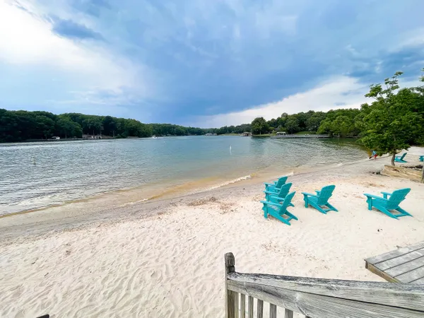 a sign that is sitting in front of flowers