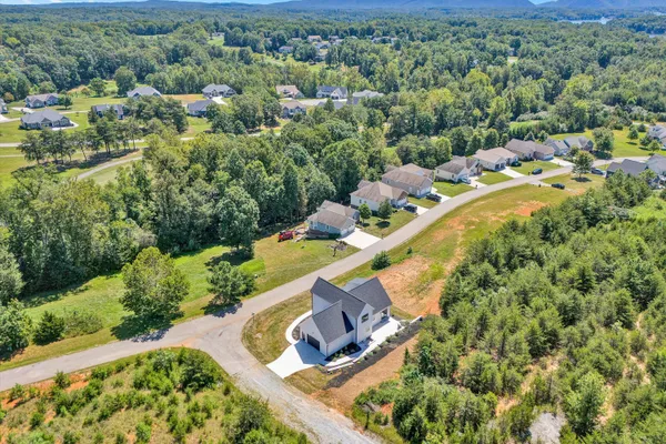 a aerial view of a house with a yard