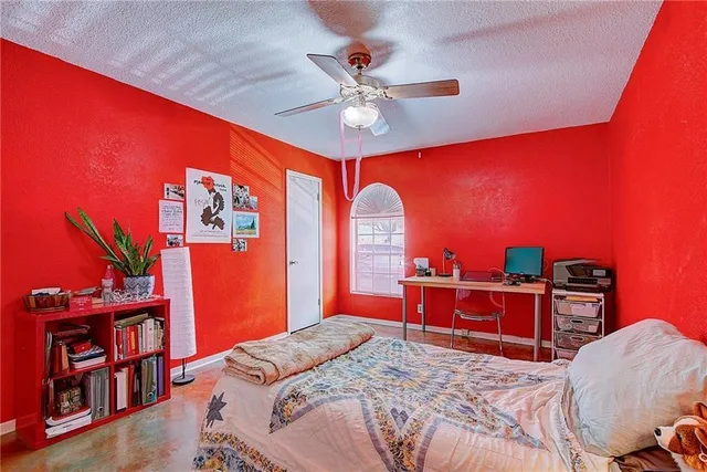 a bedroom with furniture and a chandelier
