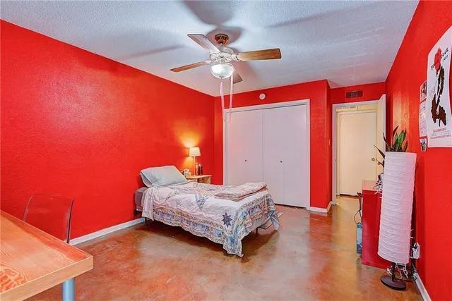 a room with a bed and a chandelier