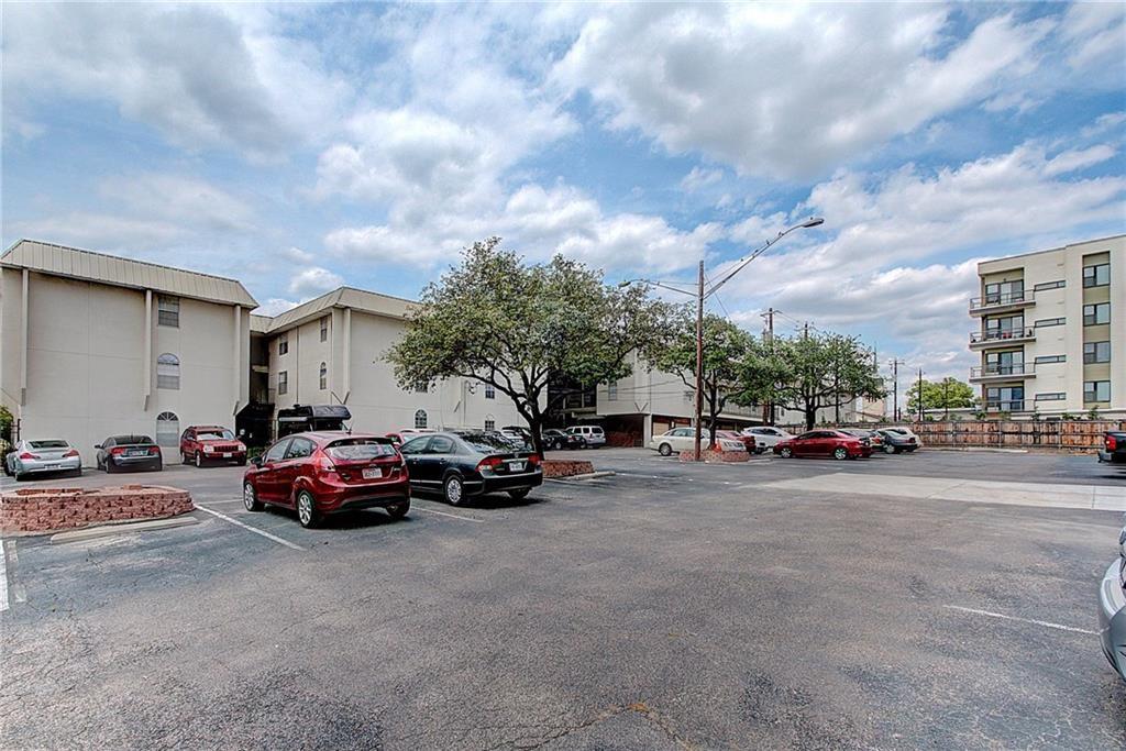 910 Duncan Lane, Unit 7 Austin, TX 78705 - Photo 19 of 20 a view of a cars parked in front of a house