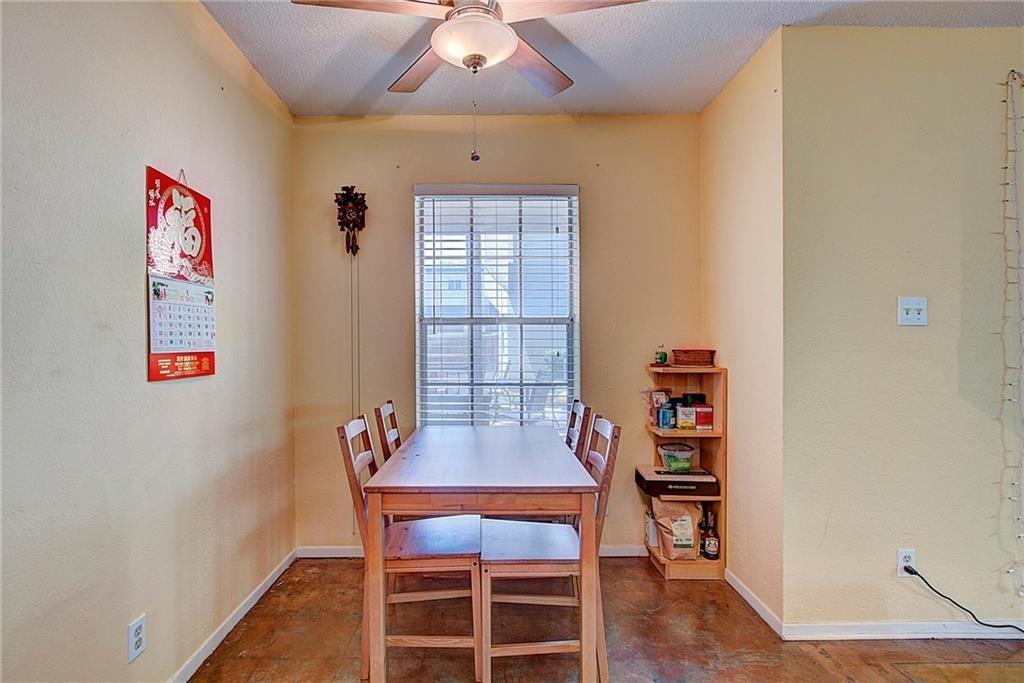 910 Duncan Lane, Unit 7 Austin, TX 78705 - Photo 2 of 20 a dining room with furniture and wooden floor