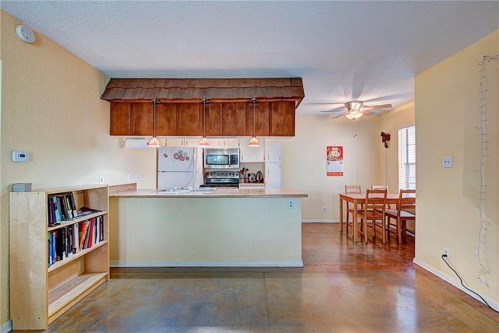910 Duncan Lane, Unit 7 Austin, TX 78705 - Photo 6 of 20 a living room with furniture and a wooden floor