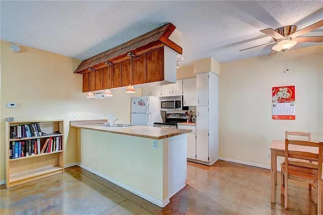 a view of kitchen and cabinets