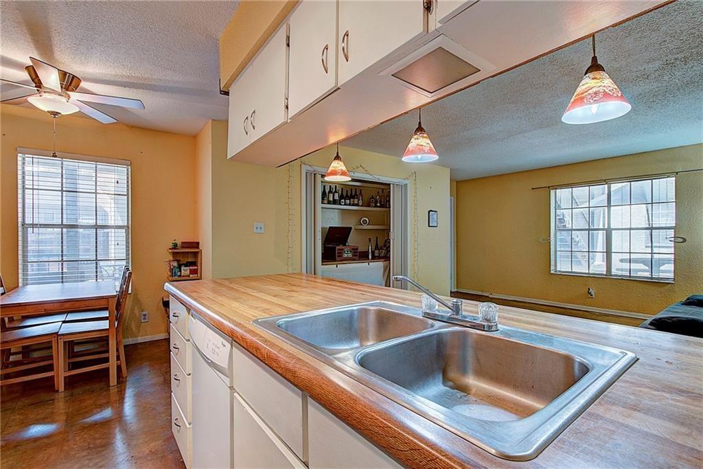 910 Duncan Lane, Unit 7 Austin, TX 78705 - Photo 10 of 20 a kitchen with a sink appliances and a counter top space