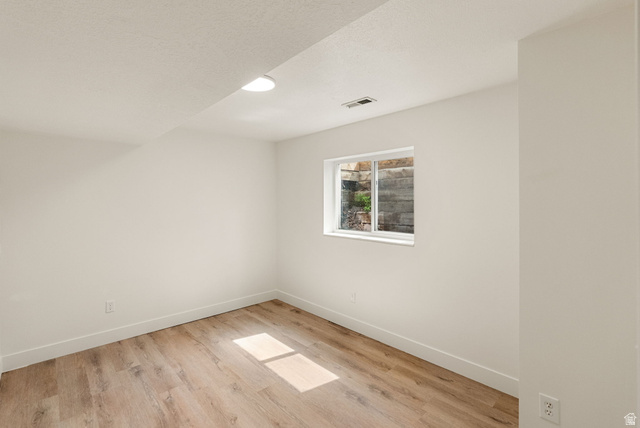 368 Spring Creek Road Providence, UT 84332 - Photo 29 of 45 Spare room with light wood-style floors and baseboards