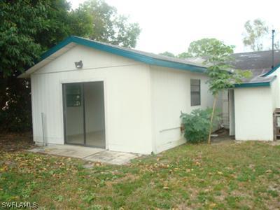 1122 Patterson Road Cape Coral, FL 33909 - Photo 2 of 8 a view of a backyard of a house