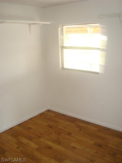 1122 Patterson Road Cape Coral, FL 33909 - Photo 5 of 8 a view of an empty room with a window