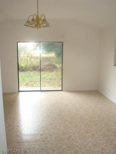 1122 Patterson Road Cape Coral, FL 33909 - Photo 7 of 8 an empty room with a window