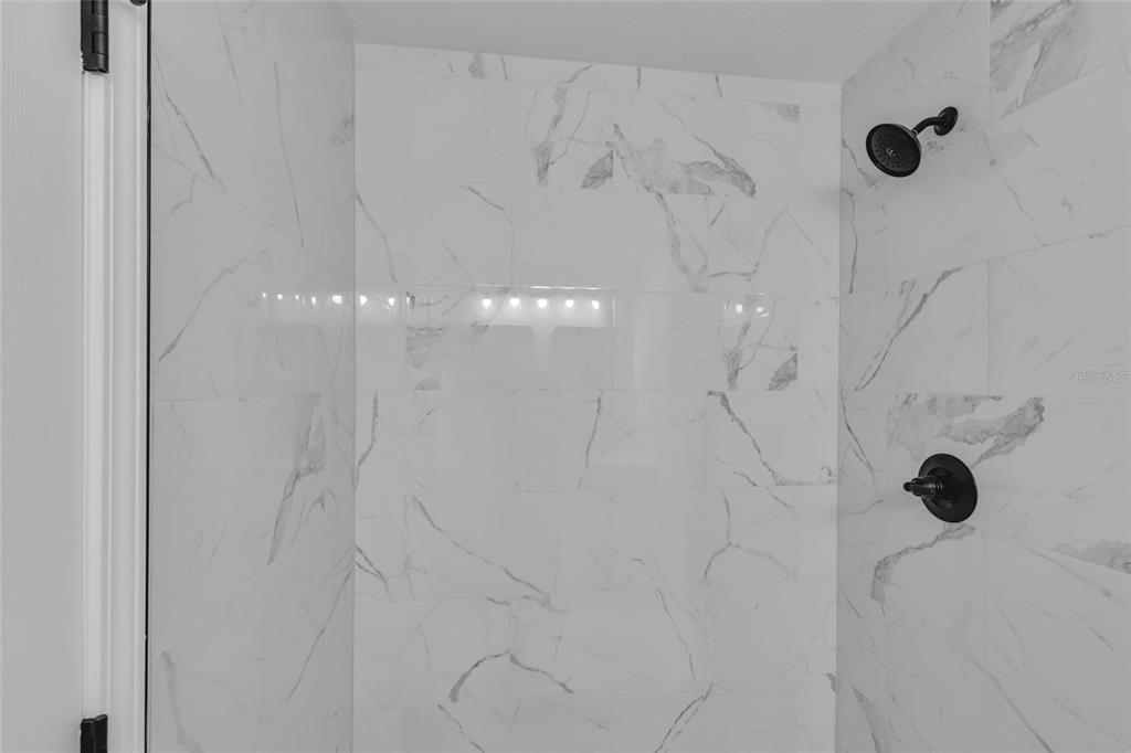 23711 Southwest Rainbow Lakes Boulevard Dunnellon, FL 34431 - Photo 19 of 27 a bathroom with a shower