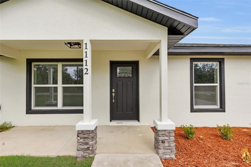 23711 Southwest Rainbow Lakes Boulevard Dunnellon, FL 34431 - Photo 4 of 27 a front view of a house