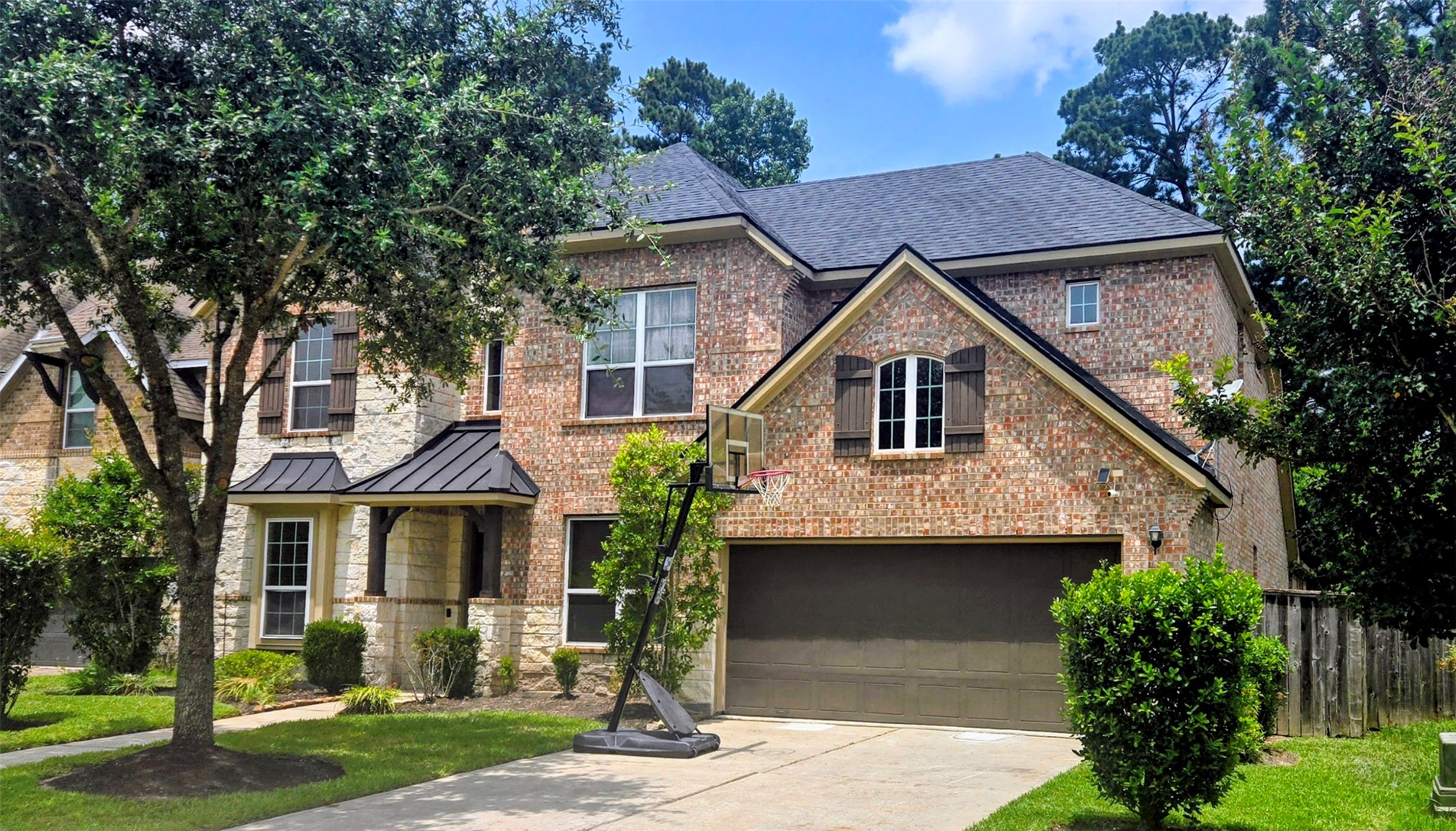 5002 Sawmill Terrace Lane Spring, TX 77389 - Photo 2 of 50 a front view of a house with garden
