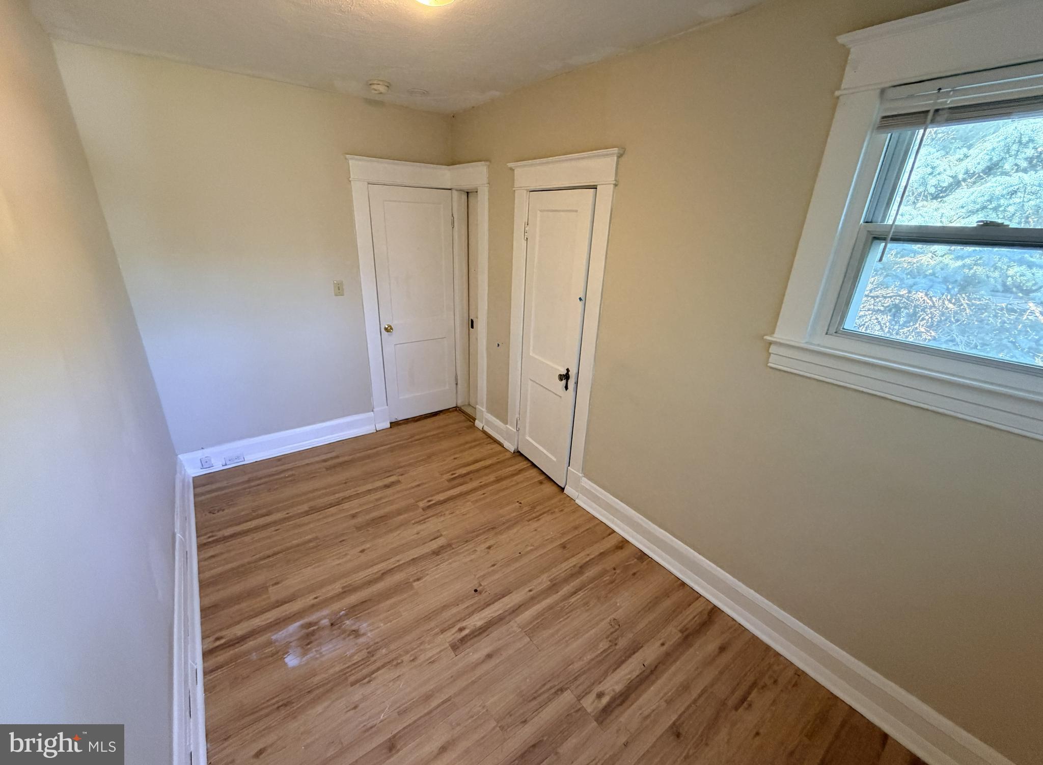 506 Cedarcroft Road Baltimore, MD 21212 - Photo 10 of 16 a view of room with wooden floor and windows