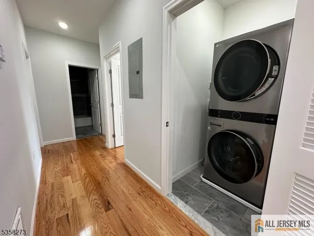 a view of a hallway with washer and dryer