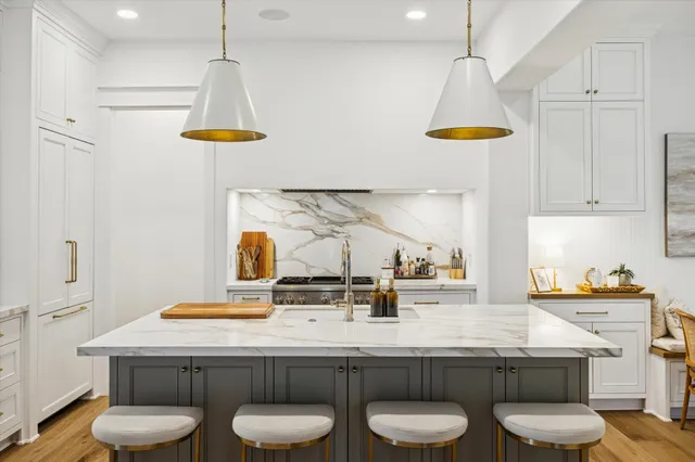 a kitchen with a table and chairs