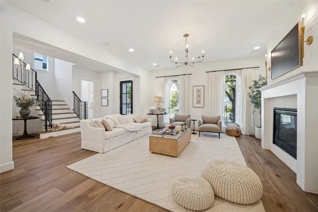 a living room with furniture or wooden floor and a fireplace