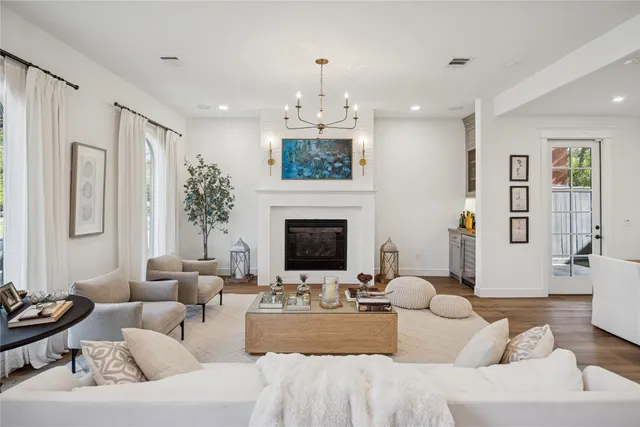 a living room with furniture fireplace and window