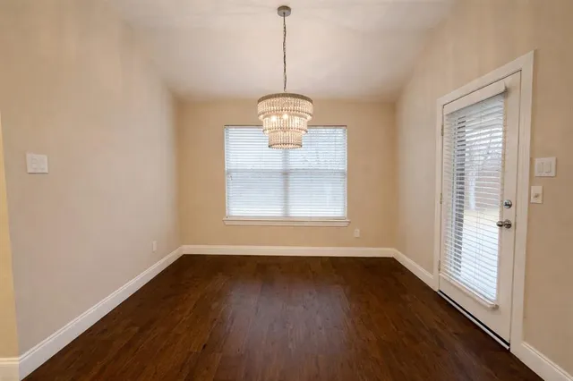 a view of room with a ceiling fan and window