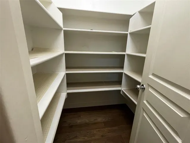 a front view of building with yard and green space