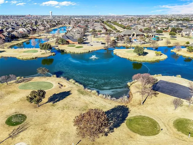 a kitchen with a refrigerator and a sink