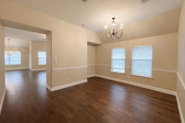 a open kitchen with kitchen island a sink dishwasher a fireplace with wooden floor