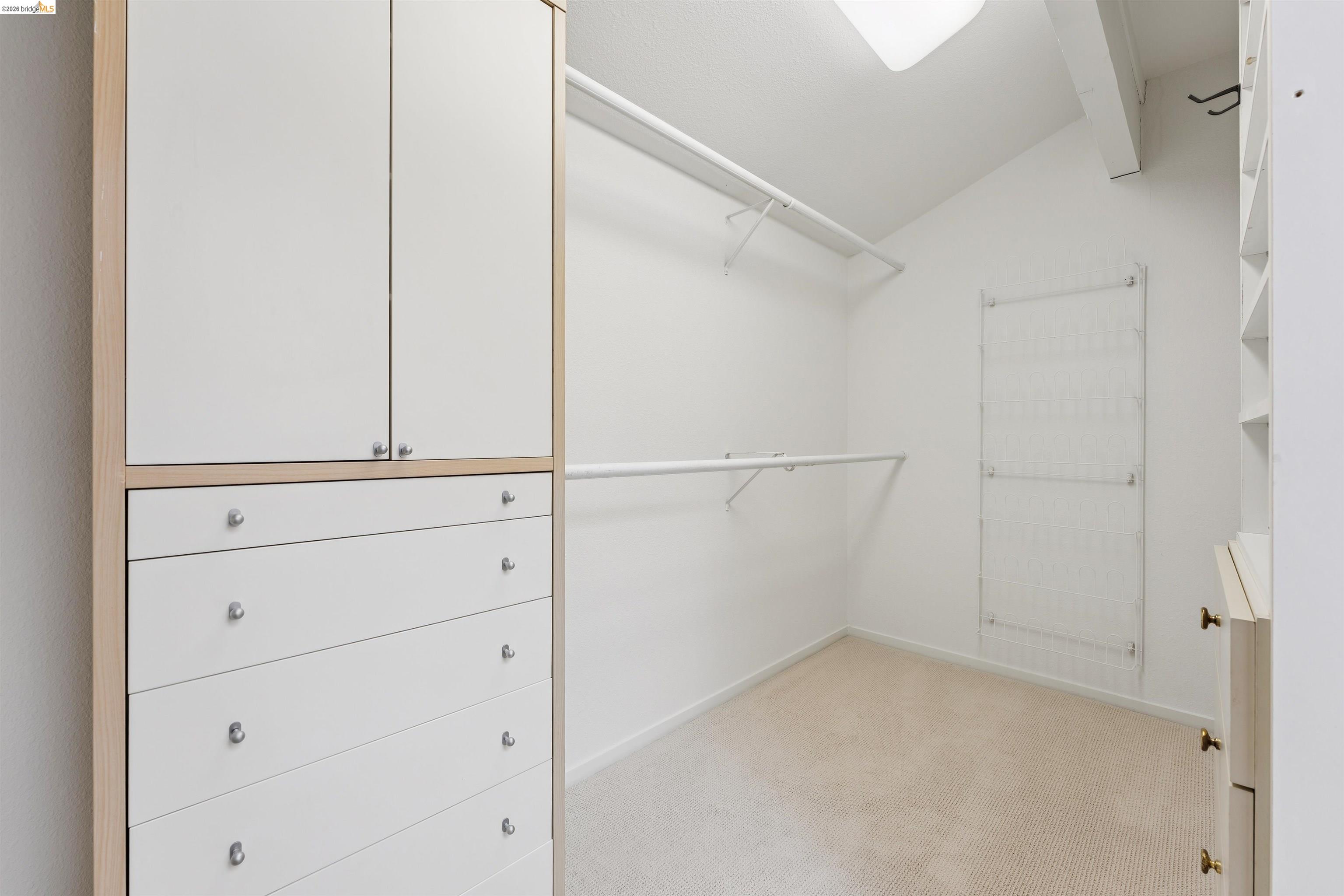 7 Jo Lin Court El Sobrante, CA 94803 - Photo 76 of 99 Walk-in closet with built-in cabinetry, white wire shelving, and neutral carpeting