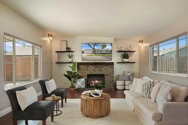 a living room with furniture and a fireplace