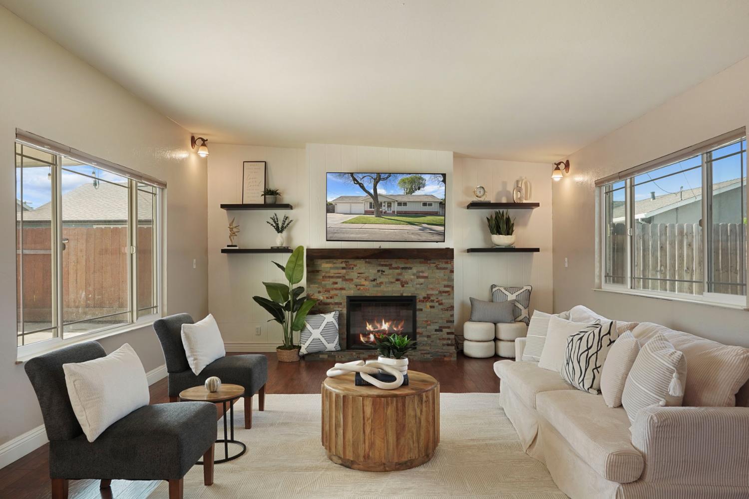 916 6th Street Ripon, CA 95366 - Photo 12 of 34 a living room with furniture and a fireplace