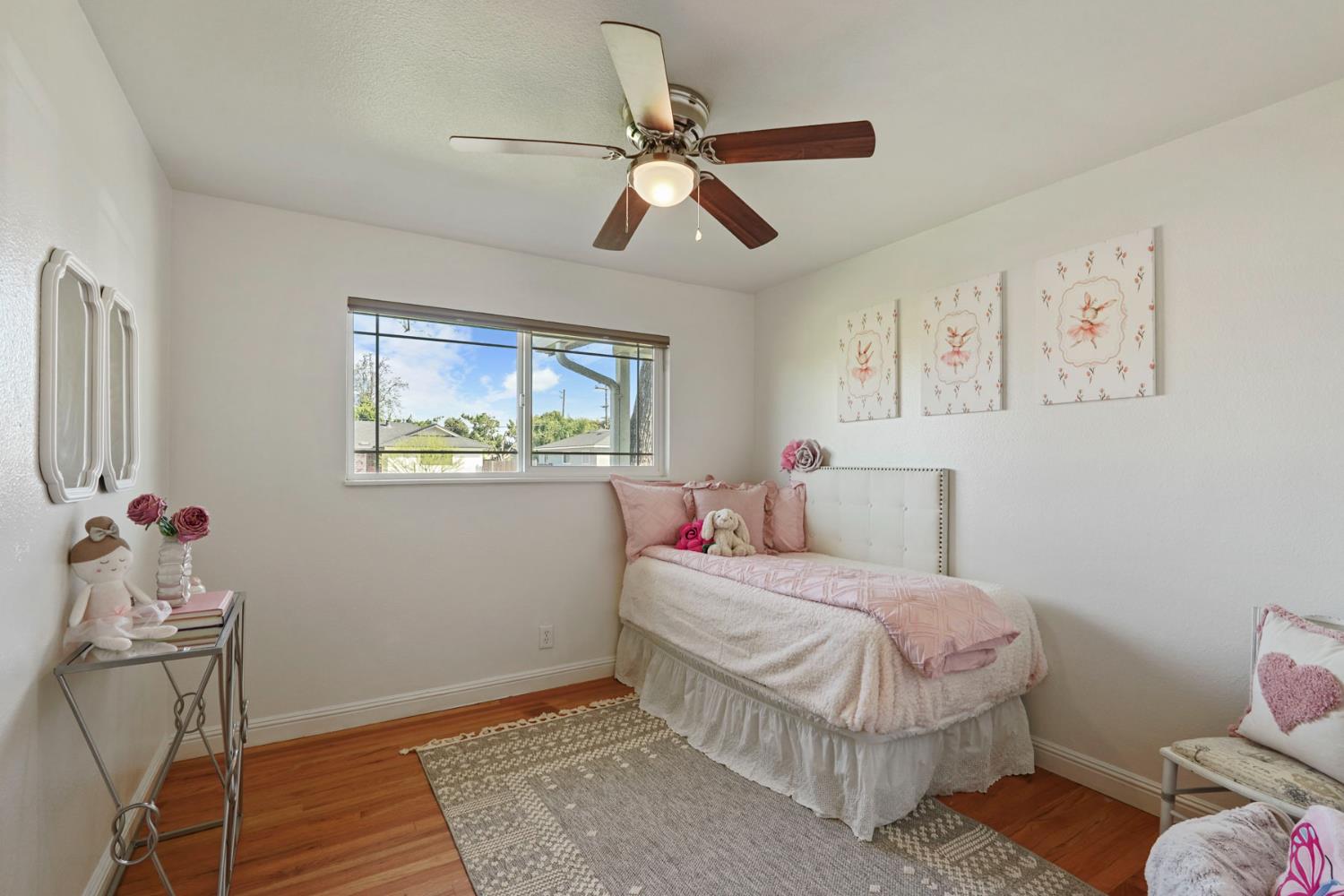 916 6th Street Ripon, CA 95366 - Photo 18 of 34 a bedroom with a bed and wooden floor