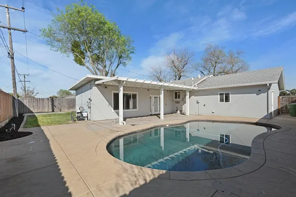 a house view with a backyard space