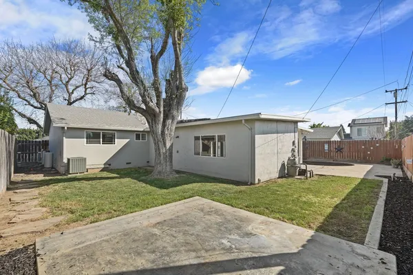 a view of a yard in front view of a house
