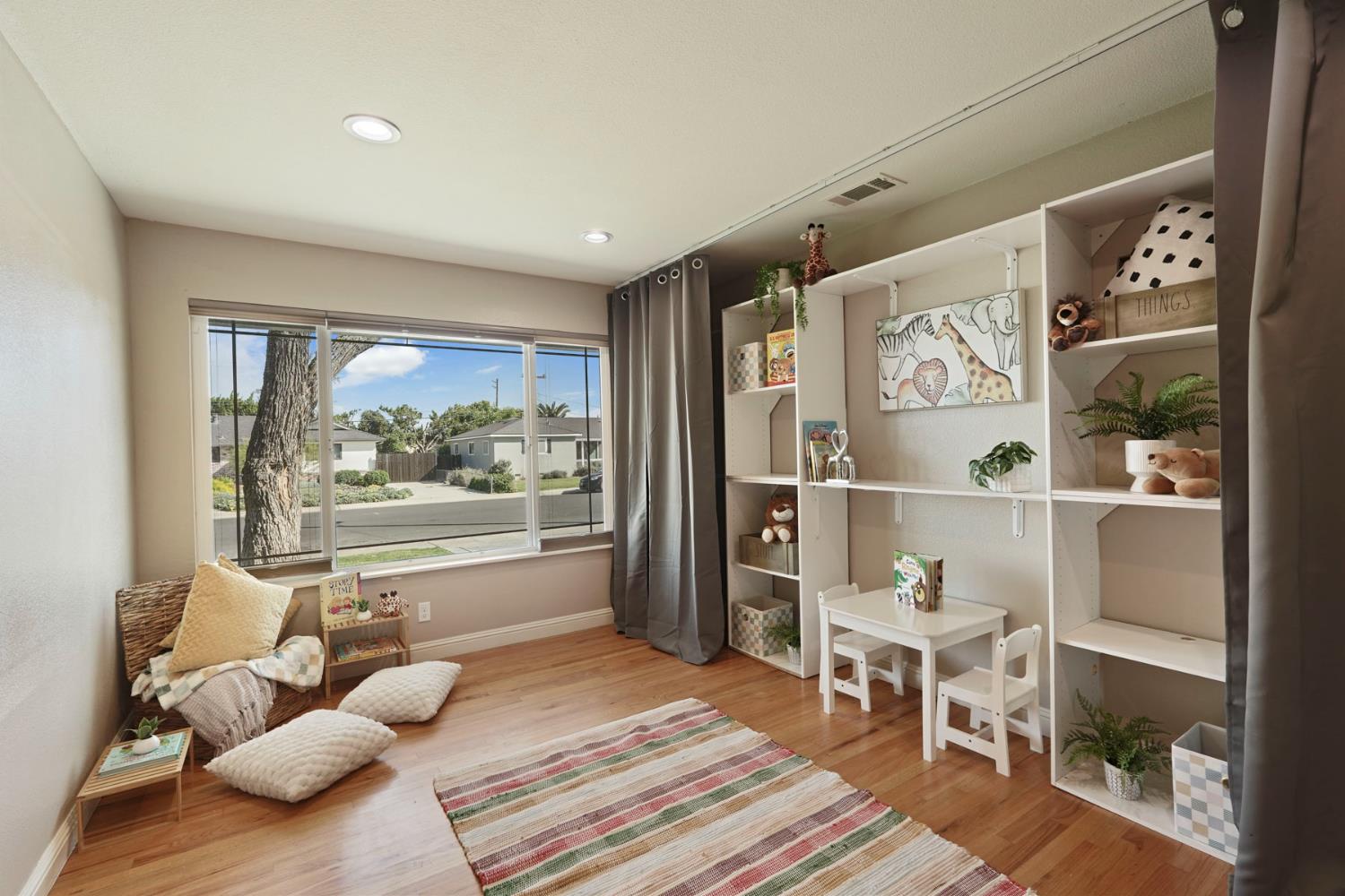 916 6th Street Ripon, CA 95366 - Photo 4 of 34 a living room with furniture and a large window