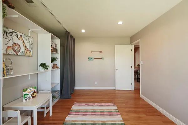 a view of livingroom with furniture and wooden floor