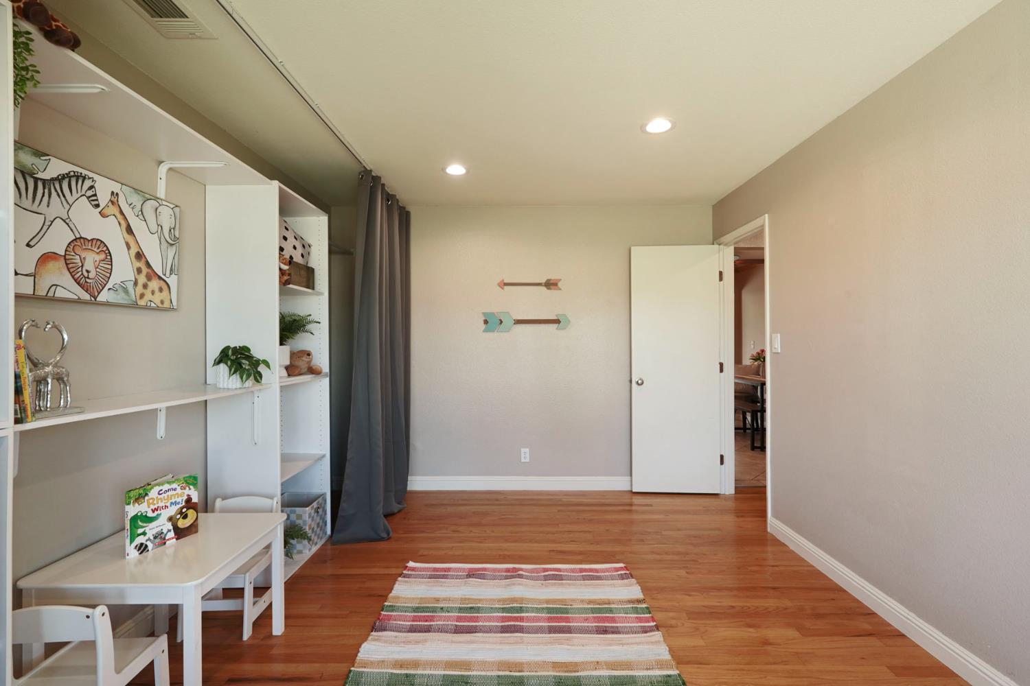 916 6th Street Ripon, CA 95366 - Photo 5 of 34 a view of livingroom with furniture and wooden floor