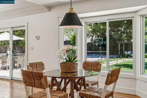 a living room with furniture and a lamp