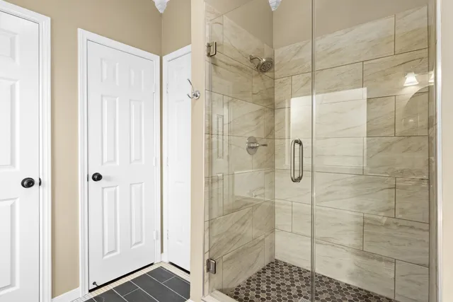 a bathroom with a shower and a sink