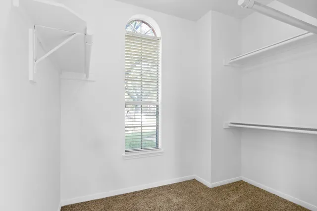 a view of empty room with windows