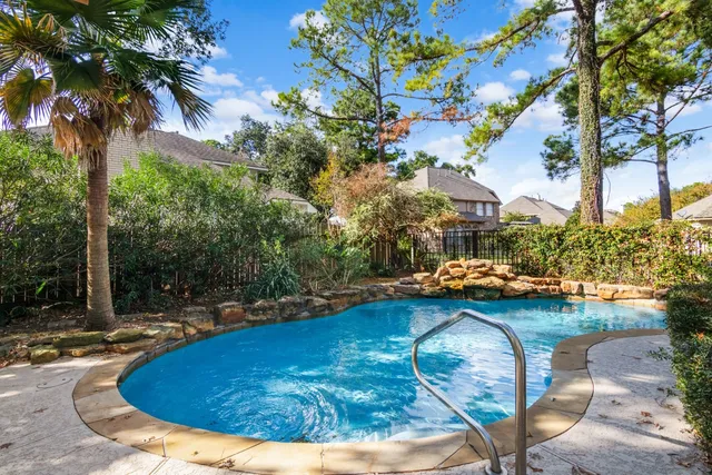 a view of swimming pool with seating space