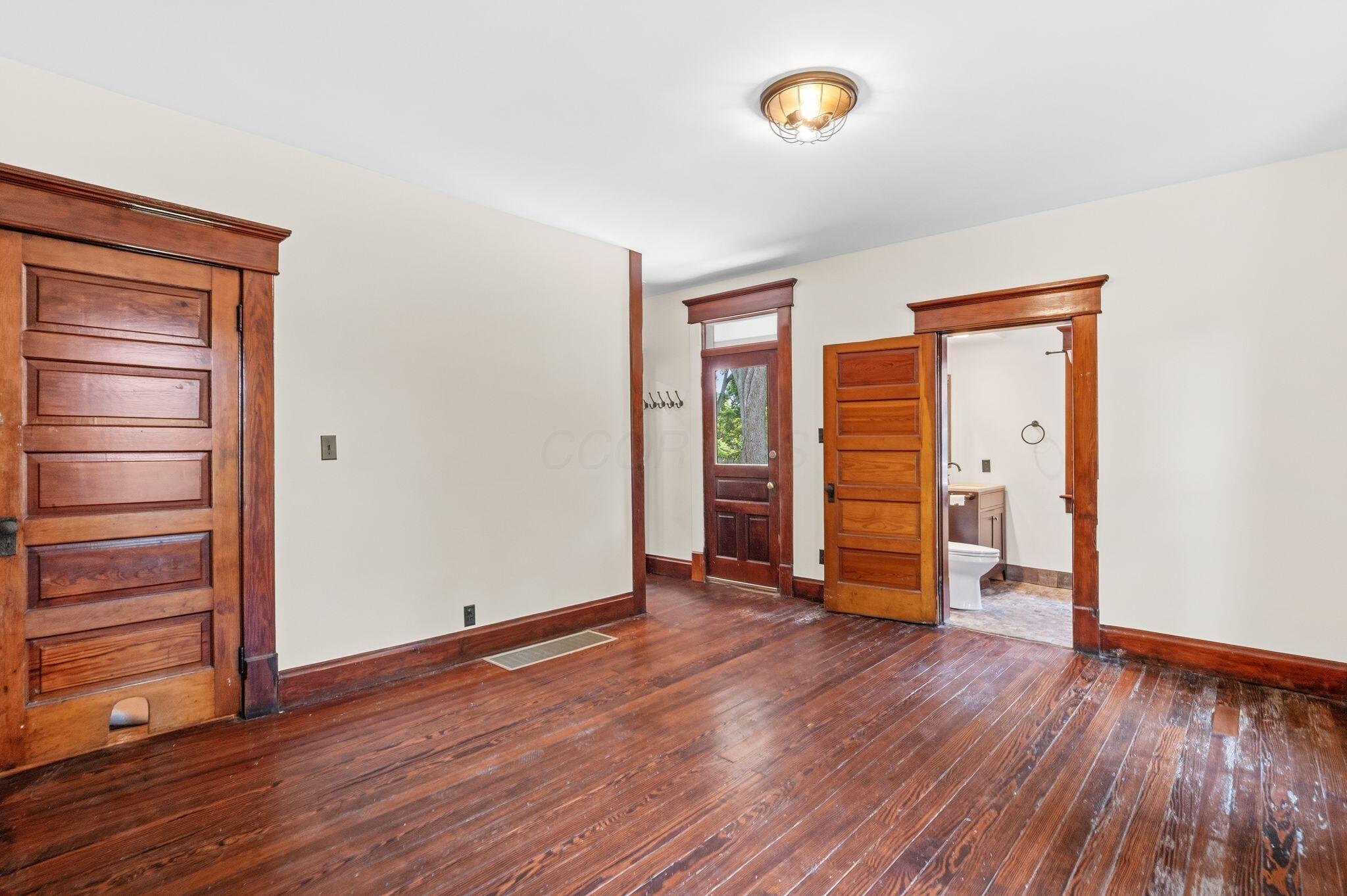 107 Price Road Columbus, OH 43230 - Photo 16 of 51 Rich wood-finish flooring complemented by substantial wood trim and doors