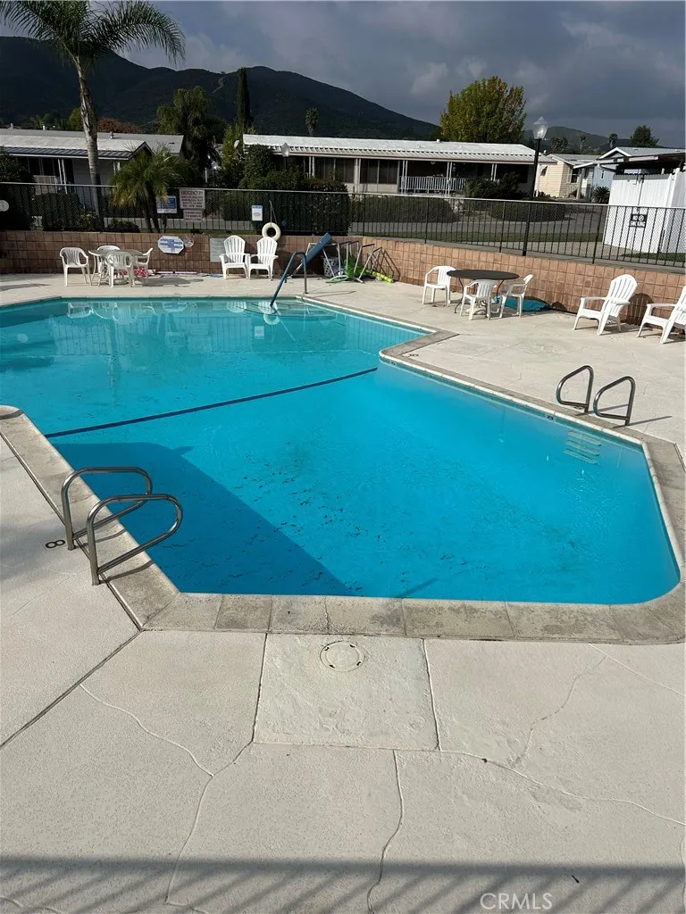 27701 Murrieta Road, Unit 228 Menifee, CA 92586 - Photo 32 of 34 a view of swimming pool with outdoor seating
