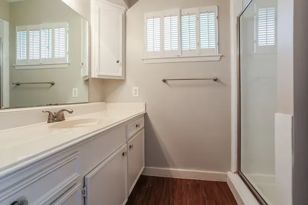 a bathroom with a sink and a window