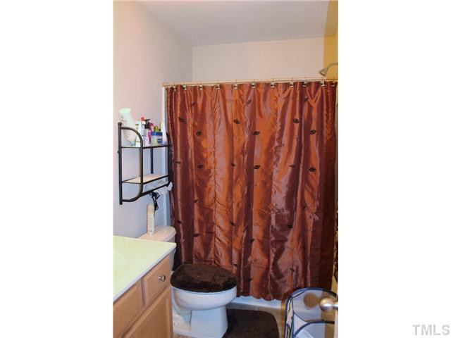 3716 Bison Hill Lane Raleigh, NC 27604 - Photo 11 of 14 a bathroom with a toilet and a sink