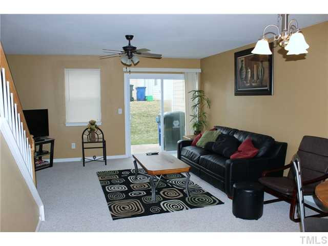 3716 Bison Hill Lane Raleigh, NC 27604 - Photo 7 of 14 a living room with furniture and a flat screen tv