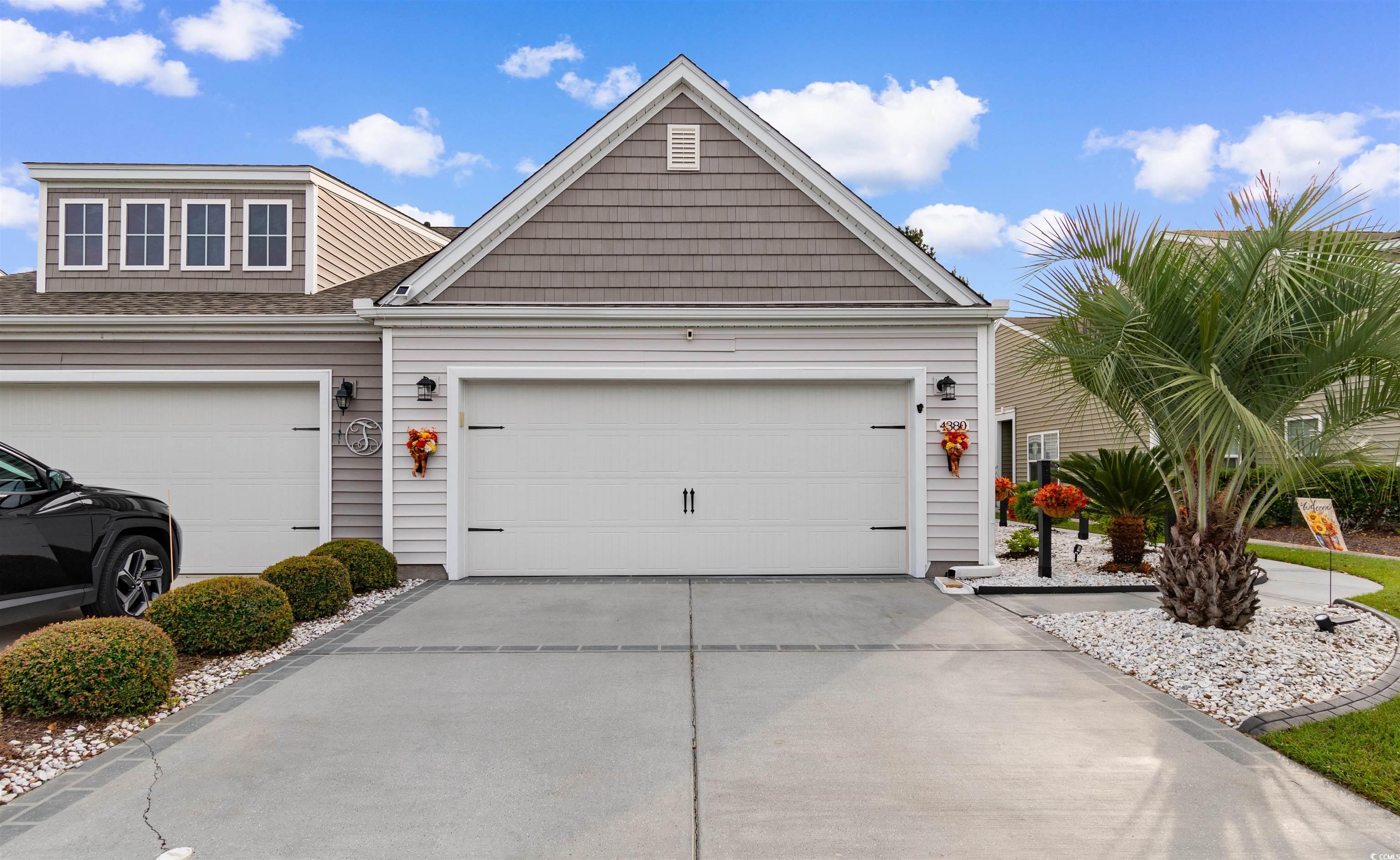 View of front of house featuring driveway