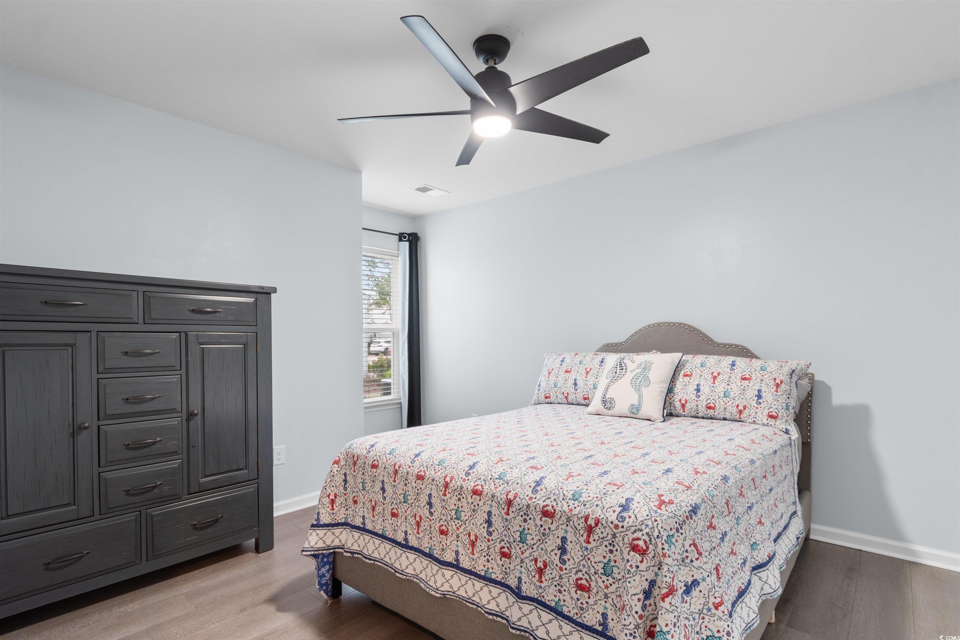 4380 Livorn Loop, Unit 4380 Myrtle Beach, SC 29579 - Photo 16 of 33 Bedroom with light wood-style floors, lofted ceiling, and a ceiling fan