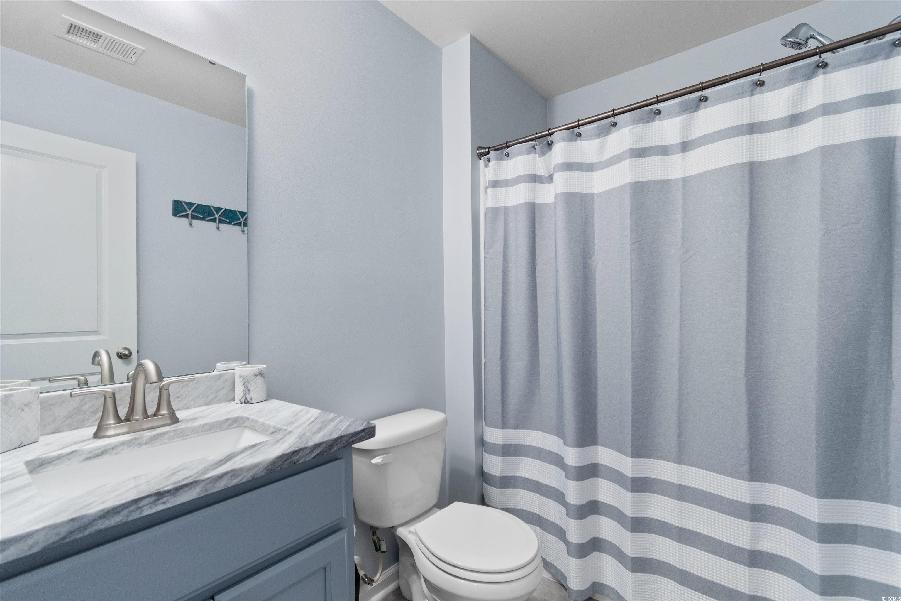 4380 Livorn Loop, Unit 4380 Myrtle Beach, SC 29579 - Photo 18 of 33 Full bathroom with a stall shower and double vanity