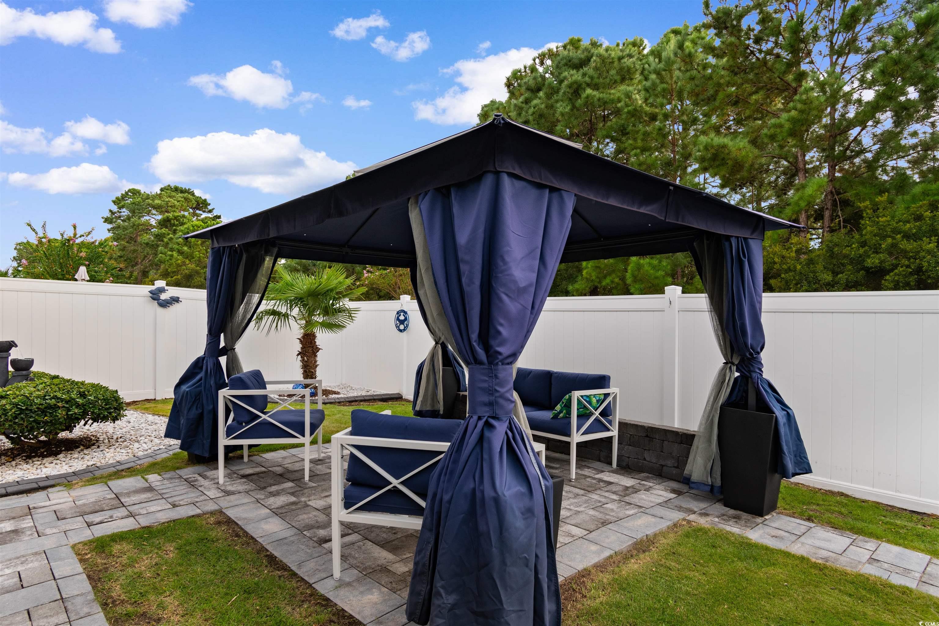 4380 Livorn Loop, Unit 4380 Myrtle Beach, SC 29579 - Photo 24 of 33 Laundry area with dark wood-style floors, washing machine and clothes dryer, and cabinet space